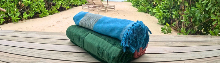 Wanneer kies je een strandlaken en wanneer een hamamdoek?