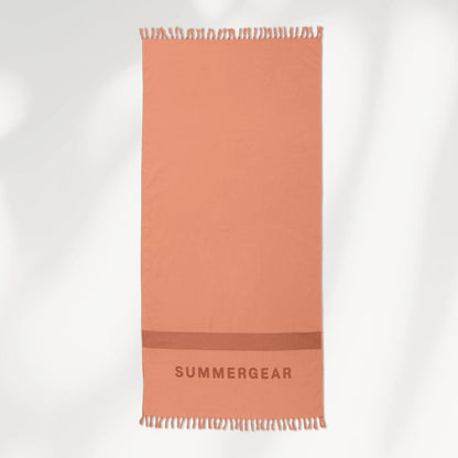 Roze hamamdoek van biologisch katoen van SummerGear volledig uitgerold in studio