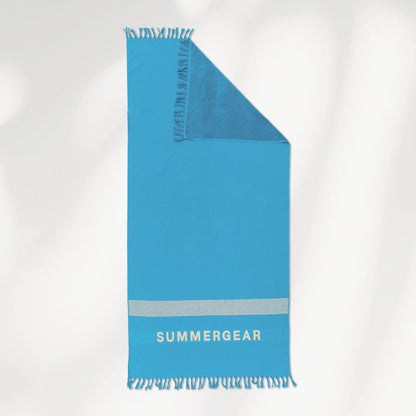 Blauwe lichtgewicht strandlaken van biologisch katoen van SummerGear met badstof en geweven kant detail