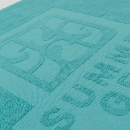 Detail van het turquoise strandlaken van biologisch katoen van SummerGear
